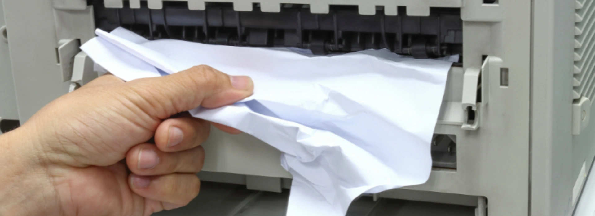 Technician fixing a printer